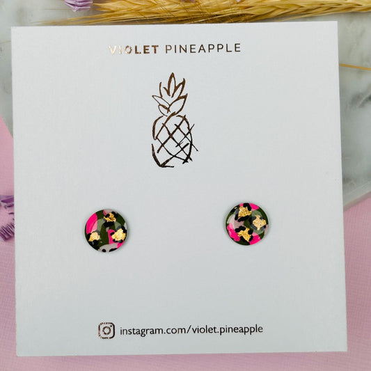 Vibrant leopard print stud earrings, handmade with polymer clay.