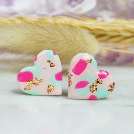 Pastel pink heart stud earrings with a spring blossom design, featuring pinks, mint green, and rose gold foil.