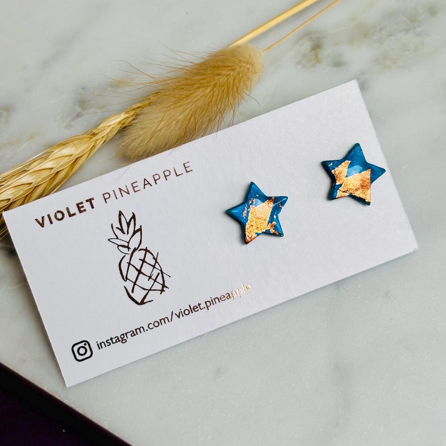 Elegant earrings with rose gold foil accents, handmade with polymer clay.