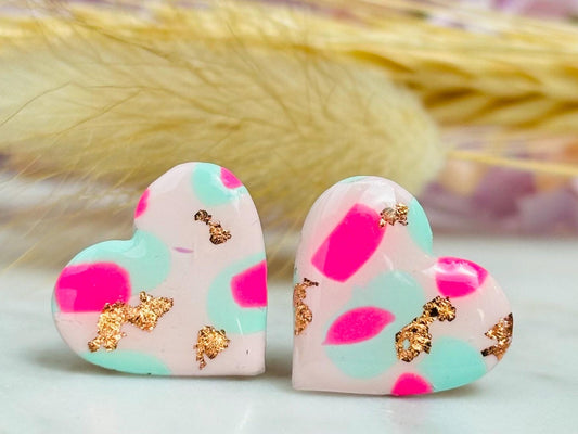 Pastel pink heart stud earrings with a spring blossom design, featuring pinks, mint green, and rose gold foil.
