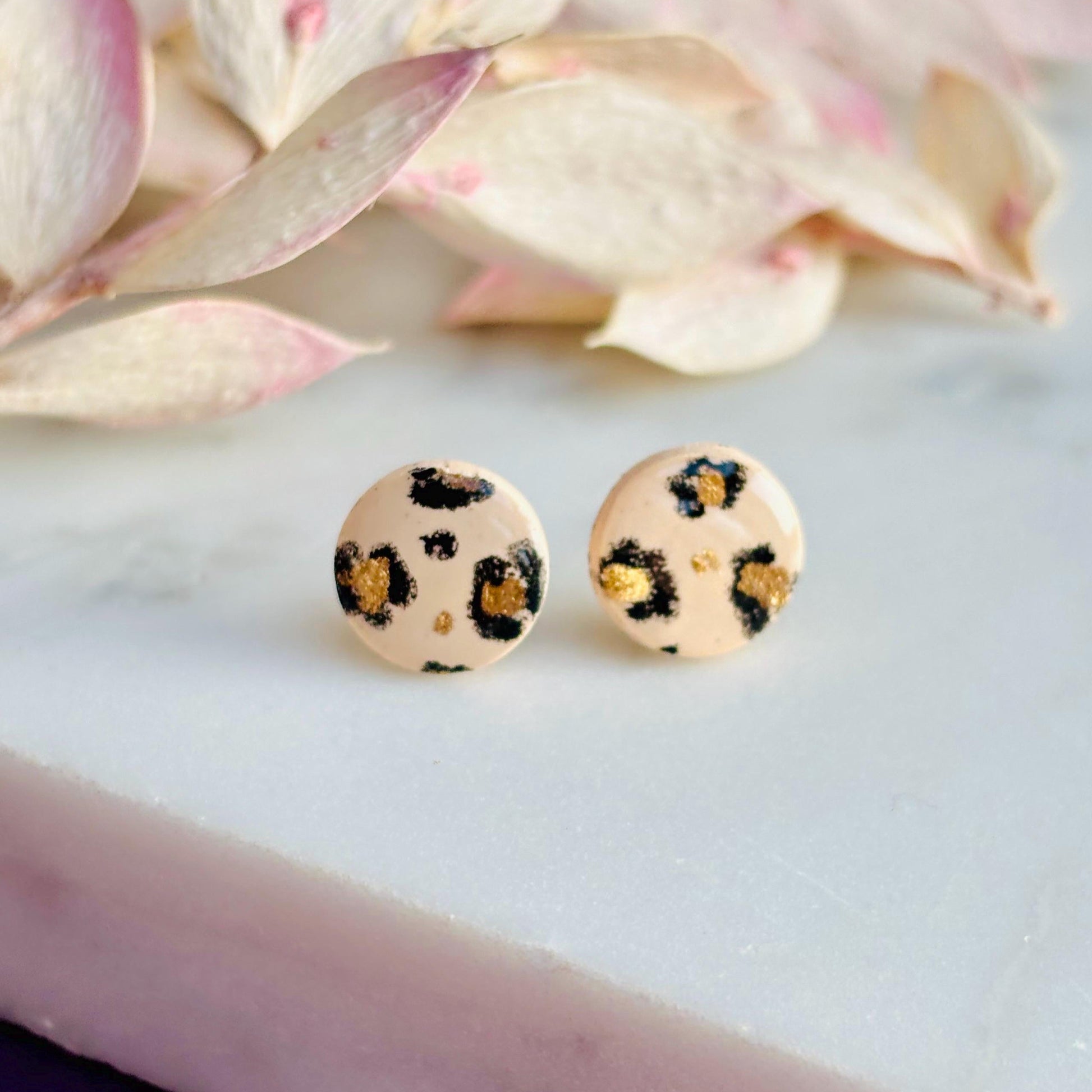 Luxe leopard print mini stud earrings with hand-painted spots, handmade with polymer clay. 10mm x 10mm.