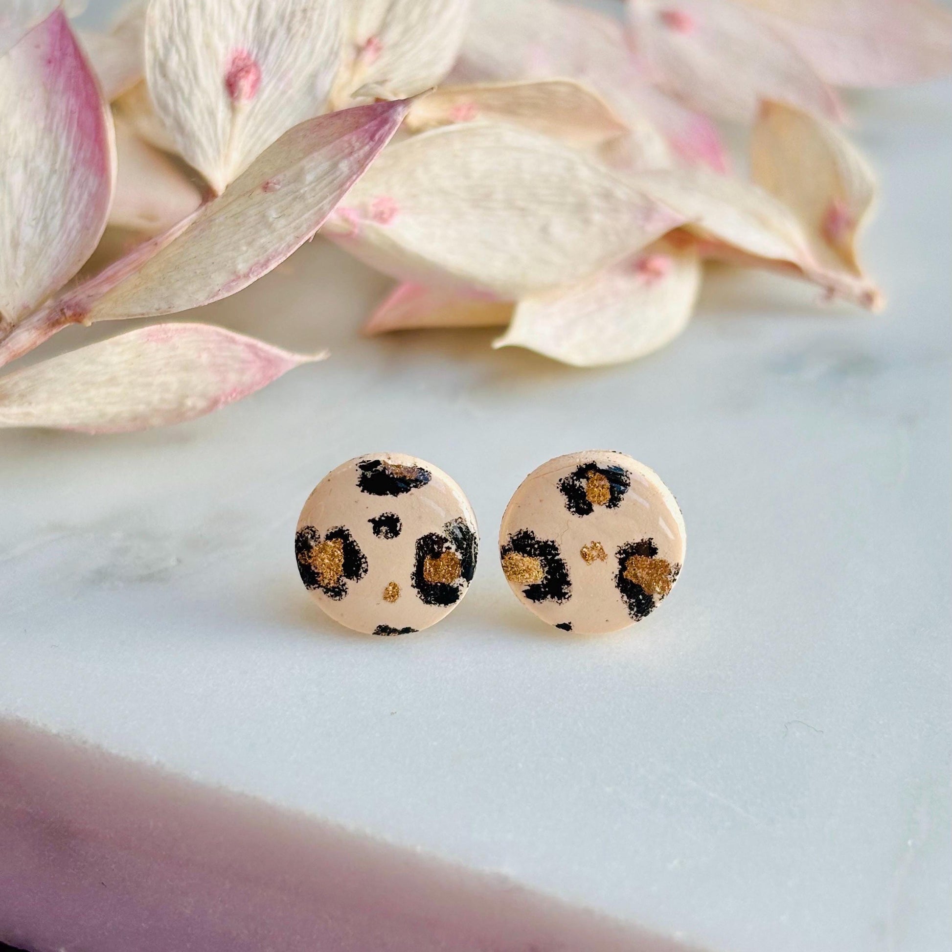 Luxe leopard print mini stud earrings with hand-painted spots, handmade with polymer clay. 10mm x 10mm.