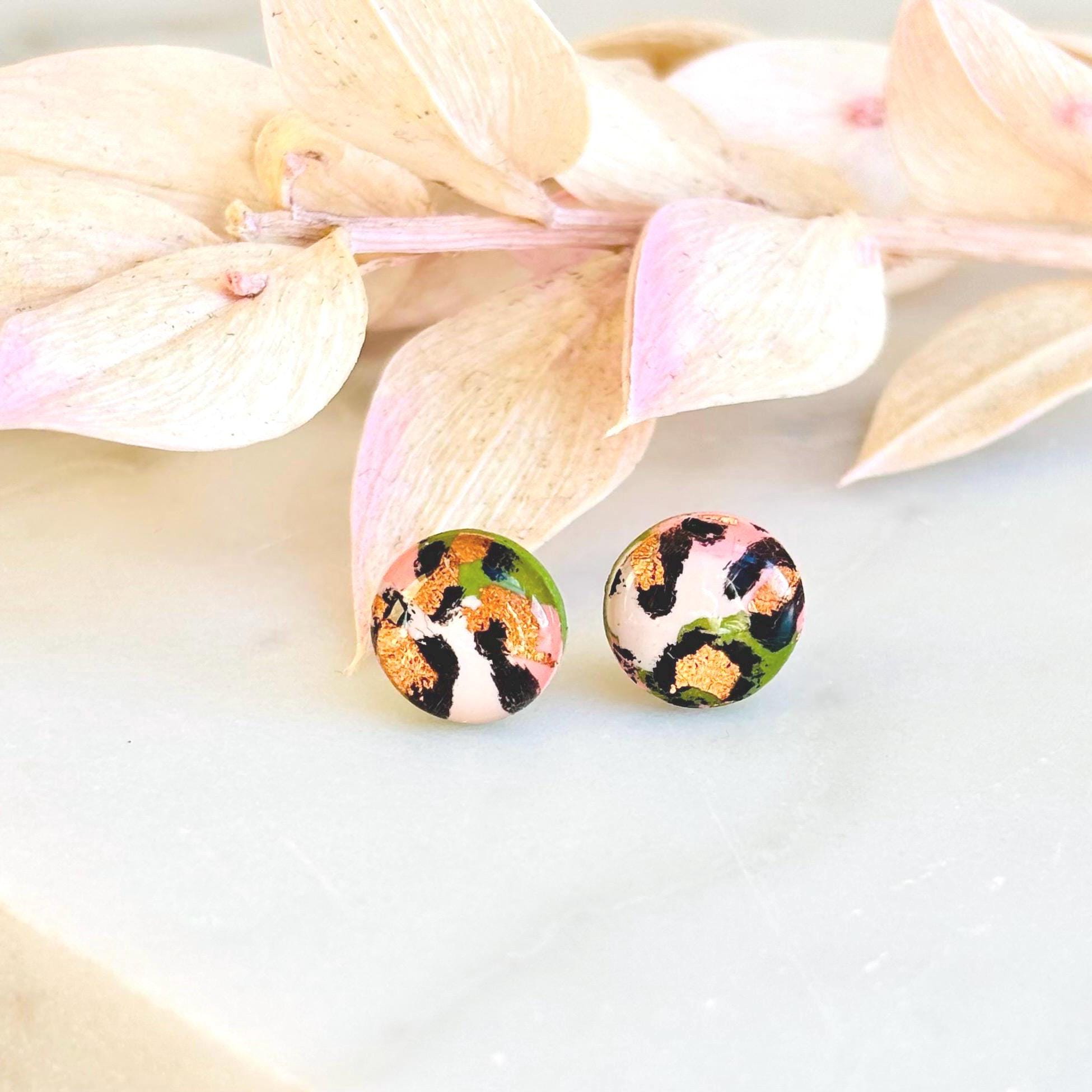 Petite leopard print stud earrings, 8mm x 8mm, with hand-painted spots in olive green and peach tones, handmade from polymer clay.