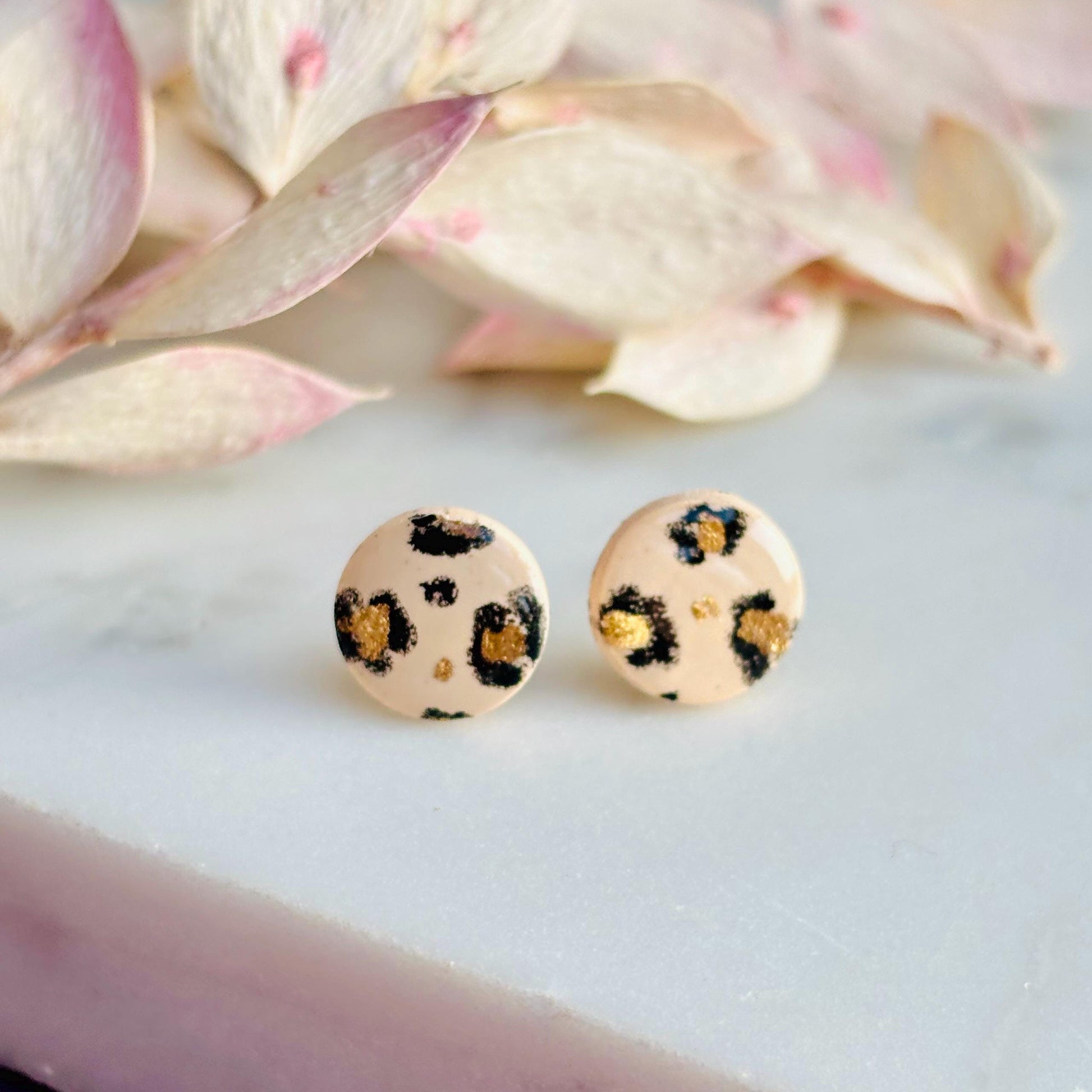 Luxe leopard print mini stud earrings with hand-painted spots, handmade with polymer clay. 10mm x 10mm.