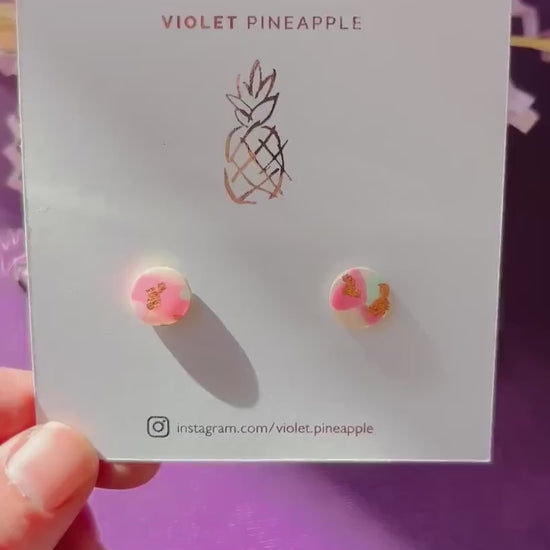 Handmade blush pink stud earrings with soft mint pastel undertones and delicate rose gold leaf detail. Finished with a glossy resin for durability and a refined look.