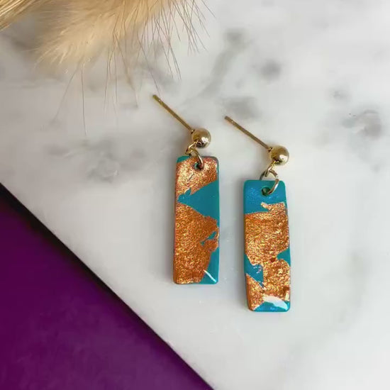 Elegant earrings with rose gold foil accents, handmade with polymer clay.