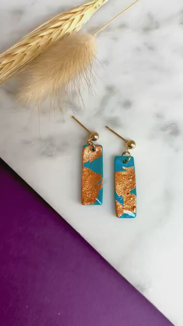 Elegant earrings with rose gold foil accents, handmade with polymer clay.
